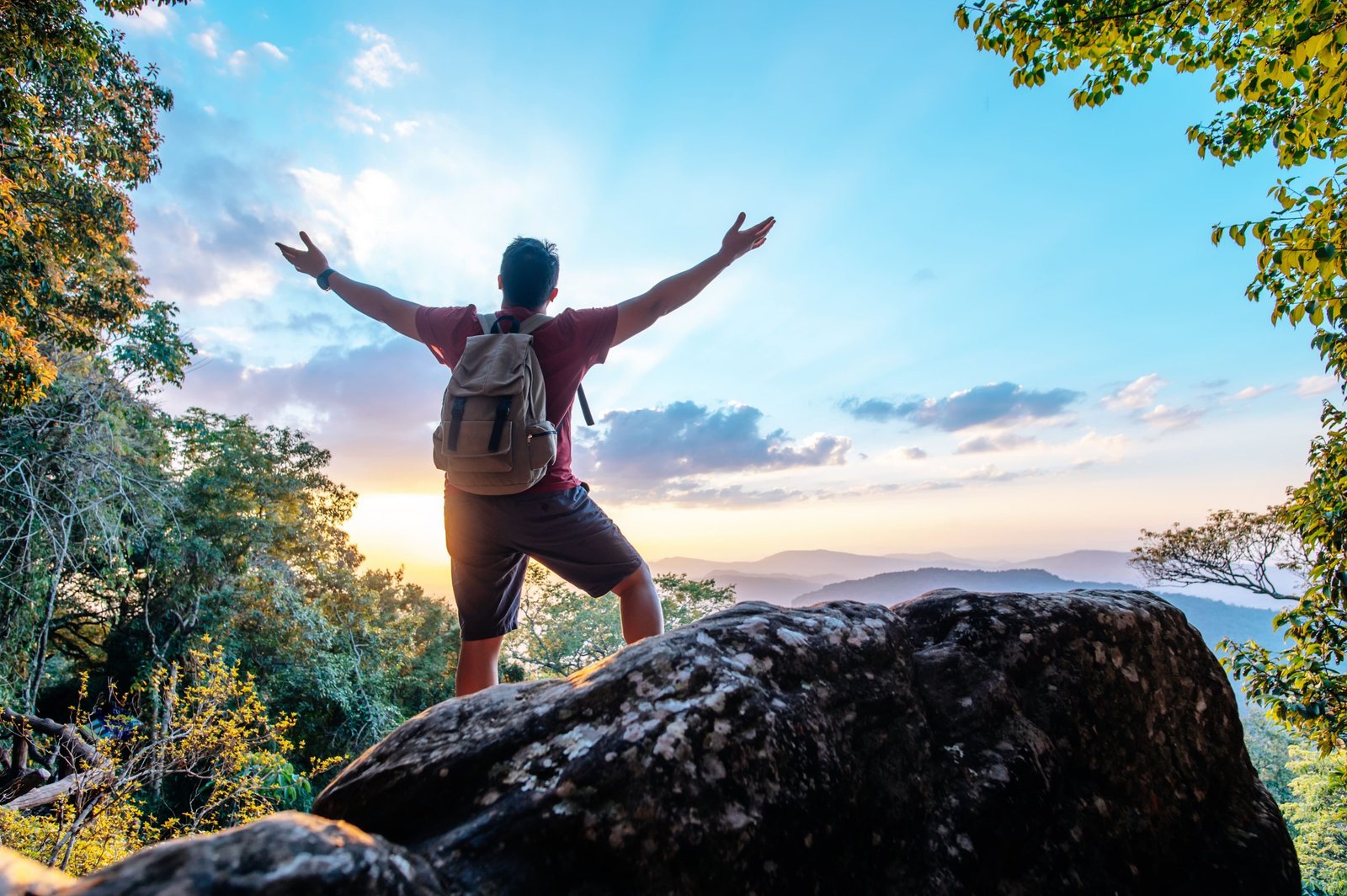 rear-view-back-young-asian-hiking-man-standing-riseup-hands-with-happy-peak-rocky-mountain-copy-space (1)